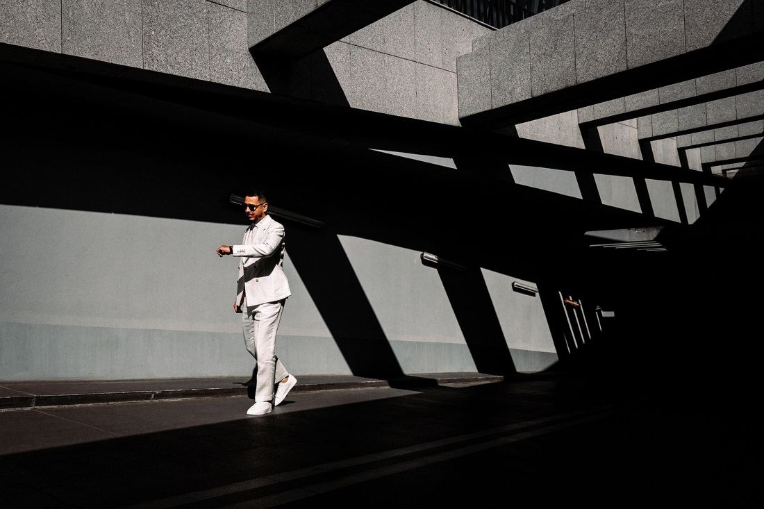 Ben Esmail beside concrete architecture